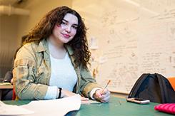 Student works at desk in Art and Design building